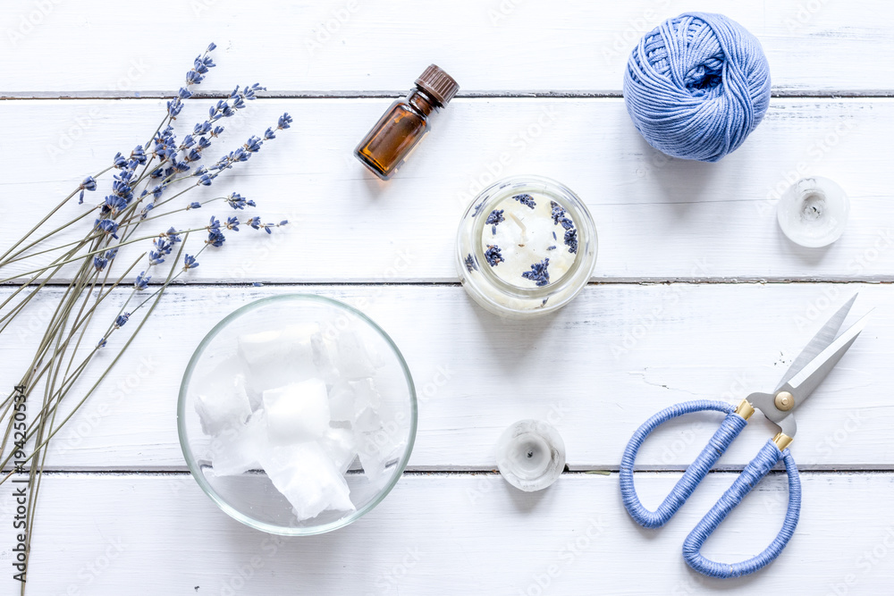 handmade candles with lavender on wooden background top view handmade candles with lavender on wooden background top view