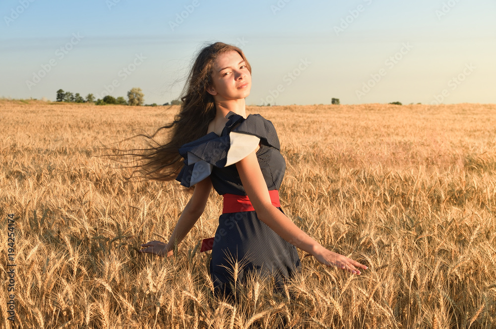 The girl with the unraveling hair spins in the field The girl with the unraveling hair spins in the field