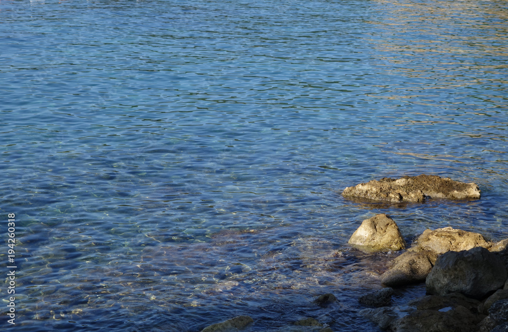 Sea pebble and stones near coast..Sea pebble and stones near coast. Water and stones. Sea pebble and stones near coast..Sea pebble and stones near coast. Water and stones.
