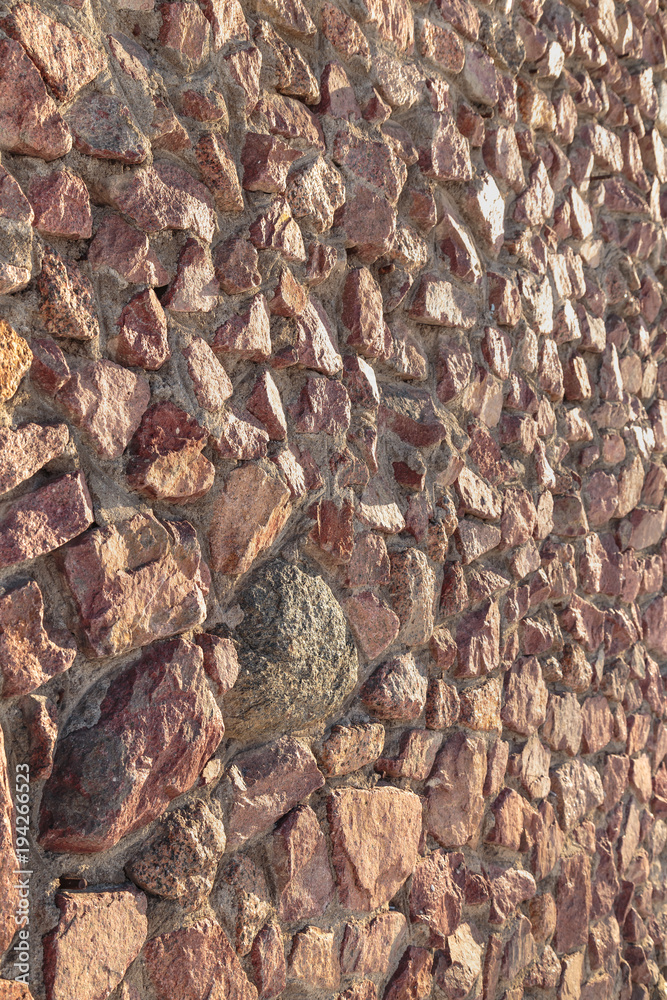 masonry of the old wall of rough cut red stone masonry of the old wall of rough cut red stone