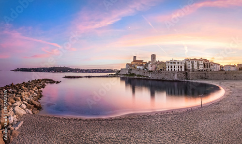 Panoramic view of Antibes on sunset from Plage de la Gravette, French Riviera, France photo