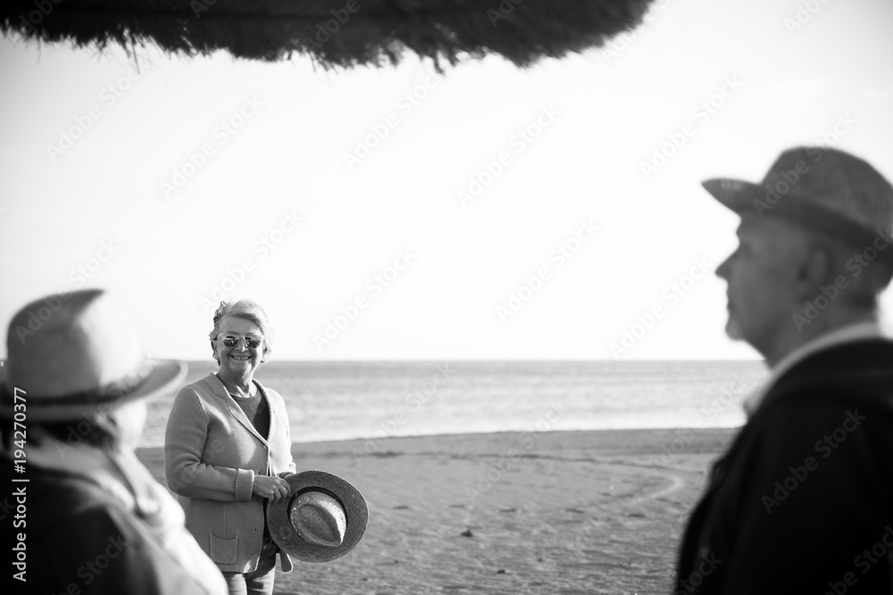 Naklejka premium elderly group on the beach in winter