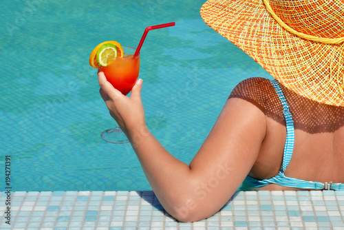 Real female beauty relaxing in swimming pool