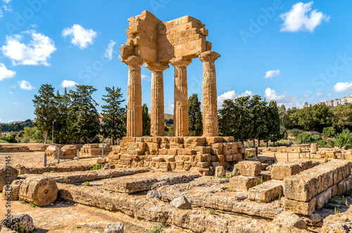 The re-assembled remains of the Temples of Castor and Pollux, located in the park of the Valley of the Temples in Agrigento, Sicily, Italy photo