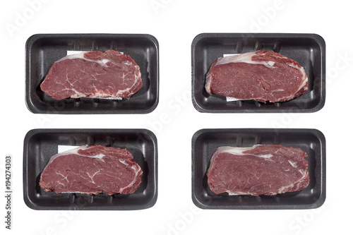 Supermarket plastic tray with veal isolated on white background. Top view
