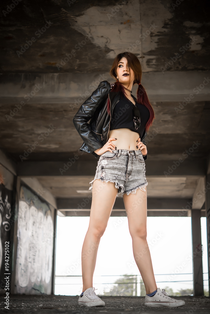 Naklejka premium Portrait of asian with black leather dress punk style,Thailand people take a picture