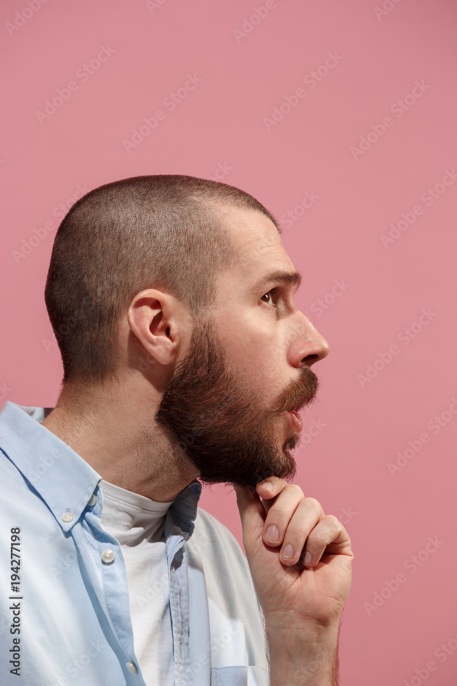 Isolated on pink young casual man is gossiping at studio Isolated on pink young casual man is gossiping at studio