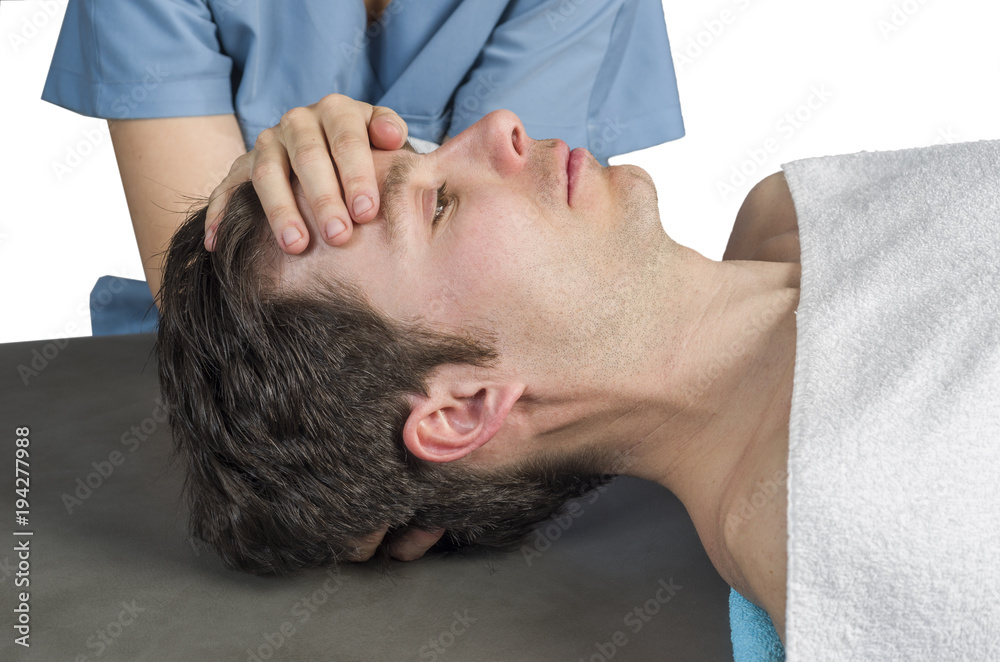 Obraz premium Physiotherapist, chiropractor doing a cranial sacral therapy to a man patient. Activating trigeminal nerve. Osteopathy. .