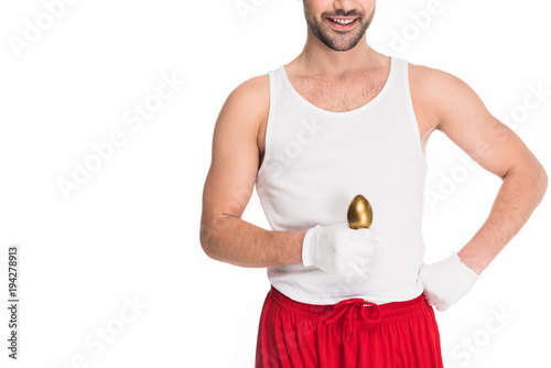 Cropped view of smiling man holding golden egg isolated on white, easter concept