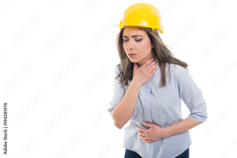 Female constructor holding her throat and stomach like hurting.