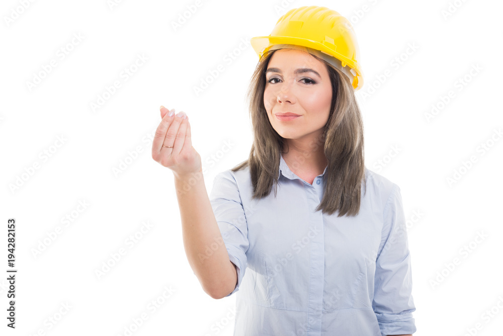 Portrait of female constructor showing money gesture.