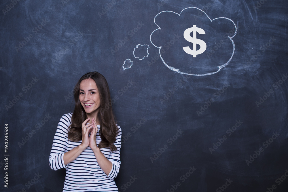 Beautiful young business woman dreaming of a high salary. Concept of money management