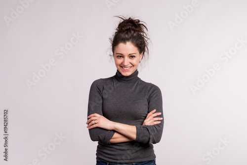 Portrait of a young beautiful woman in studio.