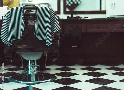 The Barber chair. Over the working day in barbershop. photo