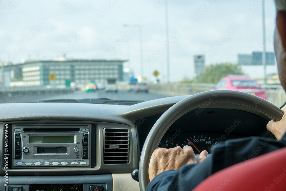 Man driving car back view