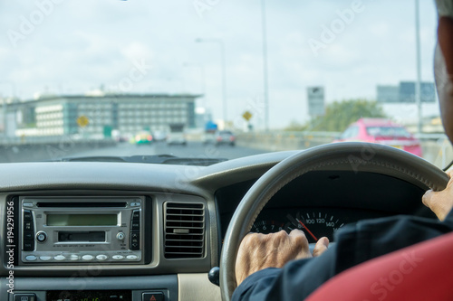 Man driving car back view