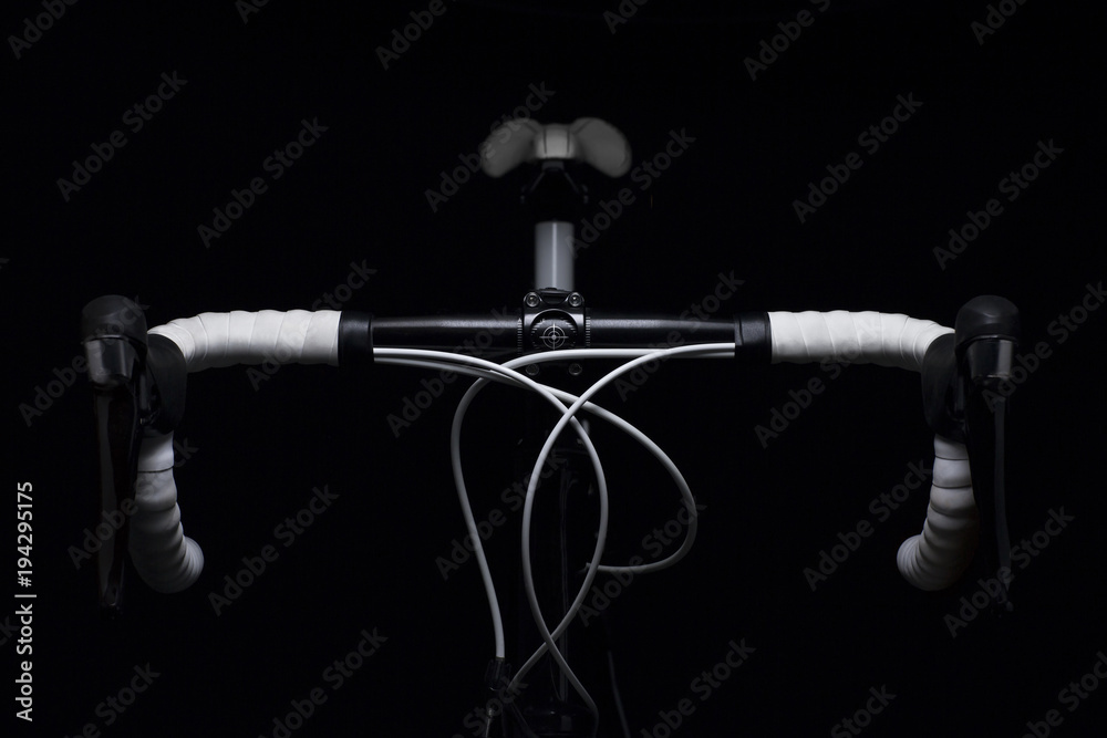 Fototapeta premium detail of a racing bike in soft light / elegant detail of the handlebars of a racing bike