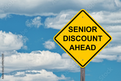 Caution Sign Blue Sky - Senior Discounts Ahead