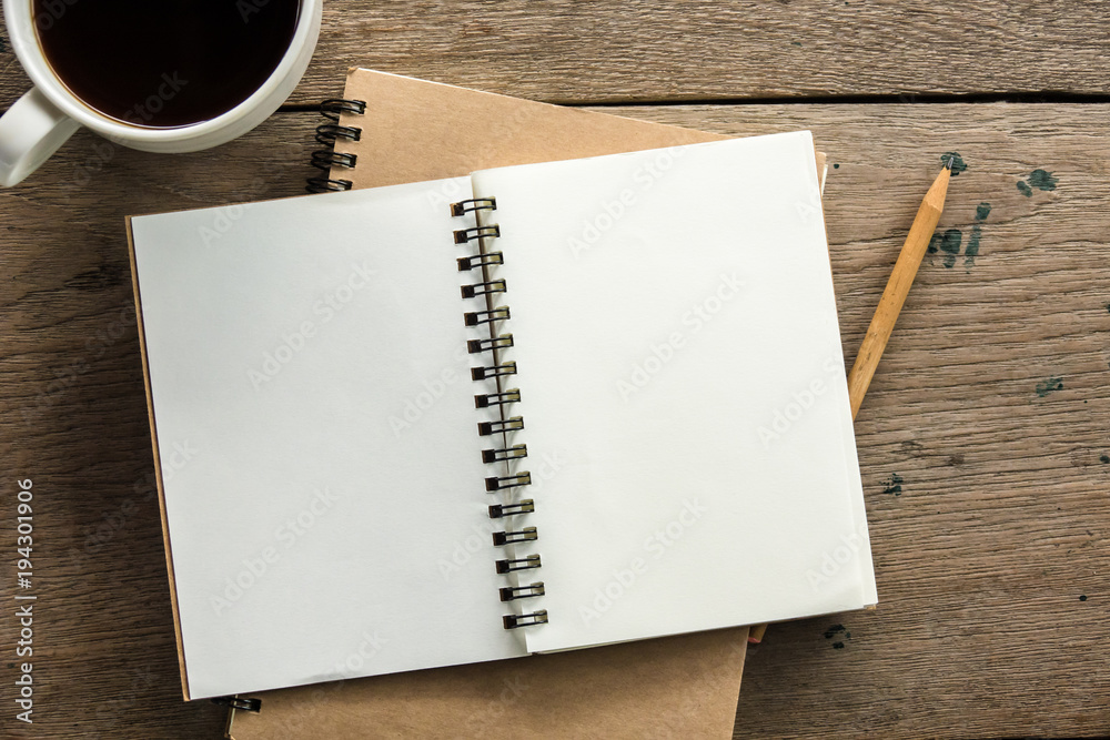 Top view of blank notebook with white coffee and natural light on wooden table. - obrazy, fototapety, plakaty 