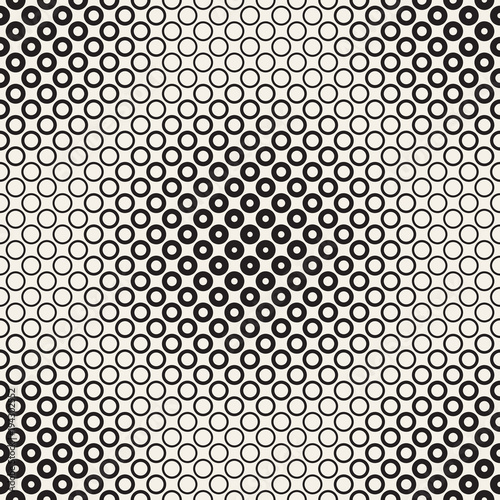 Halftone circles vector seamless pattern. Abstract geometric texture with size gradation of rings. Gradient transition effect background,