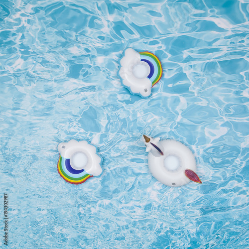Pool floats for children, rings floating in a refreshing blue pool