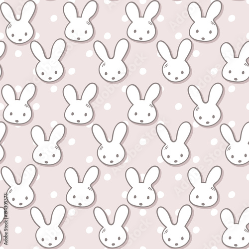 Seamless pattern with cute rabbit muzzles and polka dots