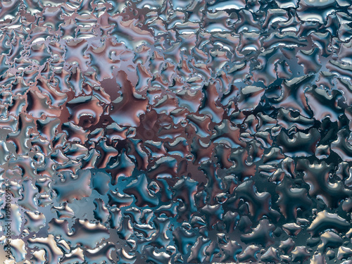 Abstract gray background with large and small convex drops of water on glass, condensation on window. Macro, close up.