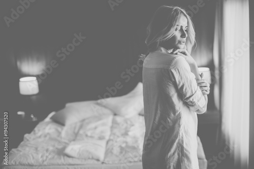 Blonde woman by window