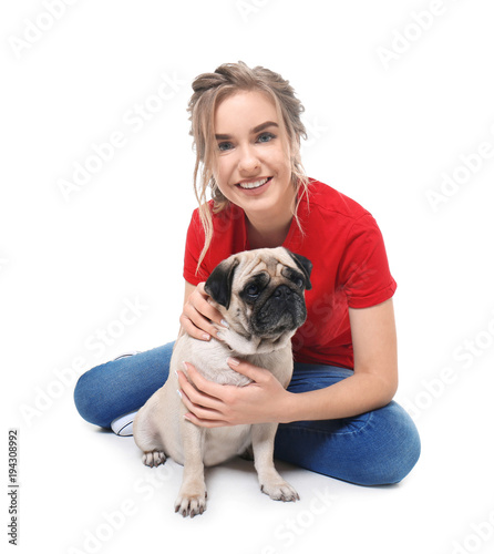 Young woman with cute pug d...