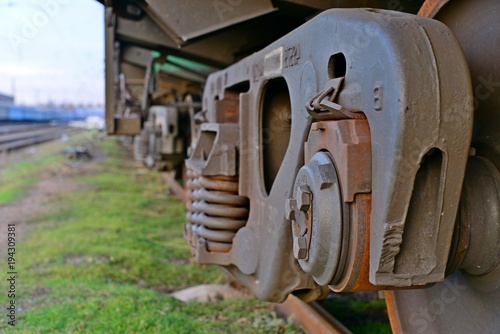 Billede på lærred Close-ups Steel diesel railcar train bogie wheels on the tracks.