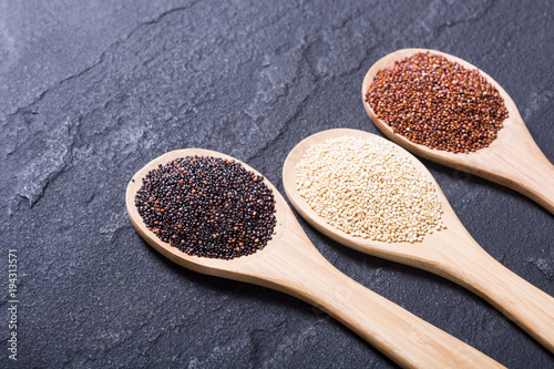 Black , white and red quinoa in spoon