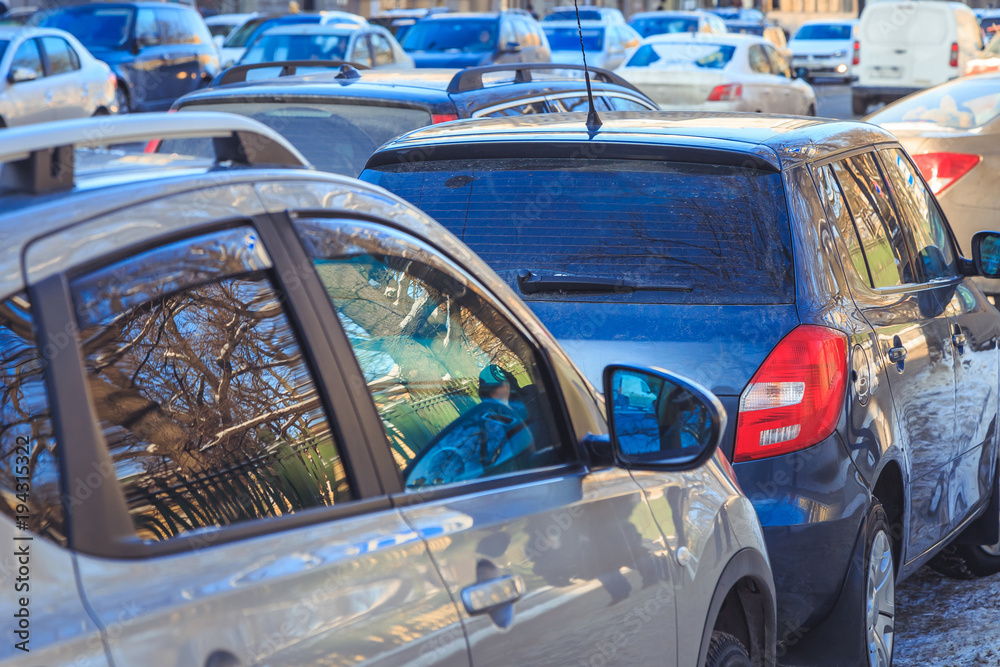 Parking used cars in winter on the street in city