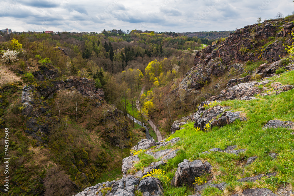 Steep rocks and valley Divoka Sarka in Prague, spring time. Wild nature park in the city.