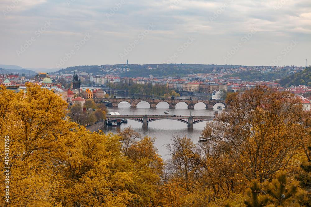 Ancient bridges of Prague over Vltava river. Heart of old town. Czech Republic. Golden autumn time.