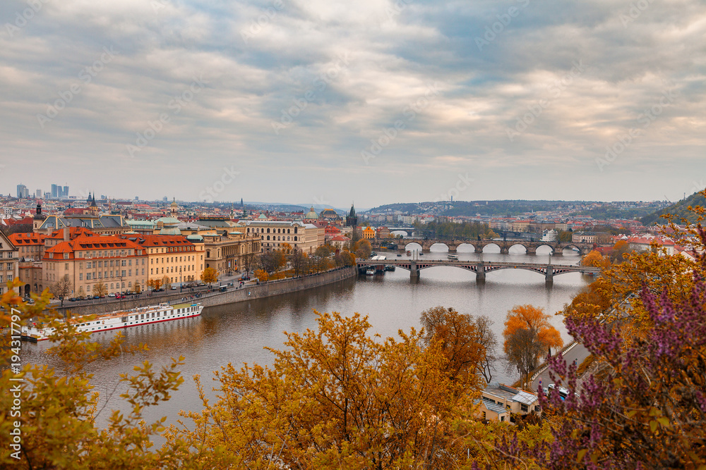 Fototapeta premium Ancient bridges of Prague over Vltava river. Heart of old town. Czech Republic. Golden autumn time.