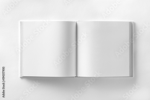 Mockup of opened blank square book at white design paper background.