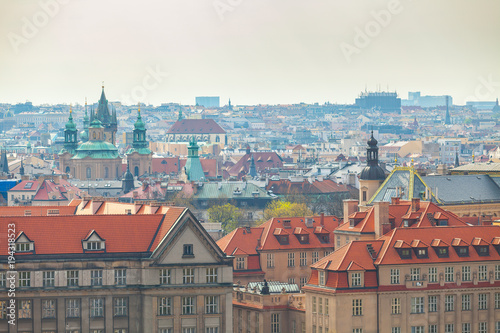 Prague rooftops. Beautiful aerial view of historic center area architecture with red roofs and modern buildings on the background