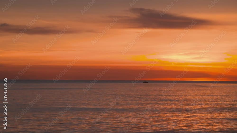Pacific sunset with flock of birds and boat Pacific sunset with flock of birds and boat