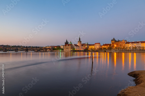 Evening view of illuminated old town and the Charles bridge. Prague, Czech Republic