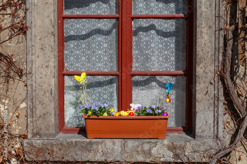 Vintage window with Easter decoration in old Europenian castle photo