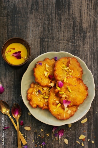 Malpua - Traditional Indian sweet pancake coated in sugar syrup