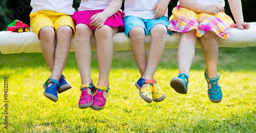 Принти на полотні Kids with colorful shoes. Children footwear