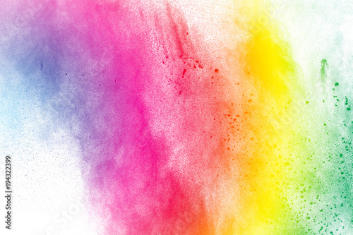 The explosion of color powder. Beautiful powder fly away. The cloud of glowing color powder on white background