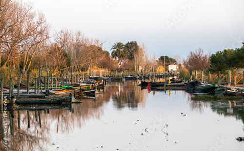 Catarroja Valencia Spain several traditional wooden boats on the mooring dock. harbor of the Albufera nature reserve,