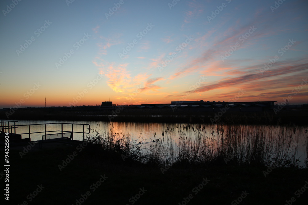 Sunset with variety of colors above river Rotte in Zevenhuizen, The Netherlands