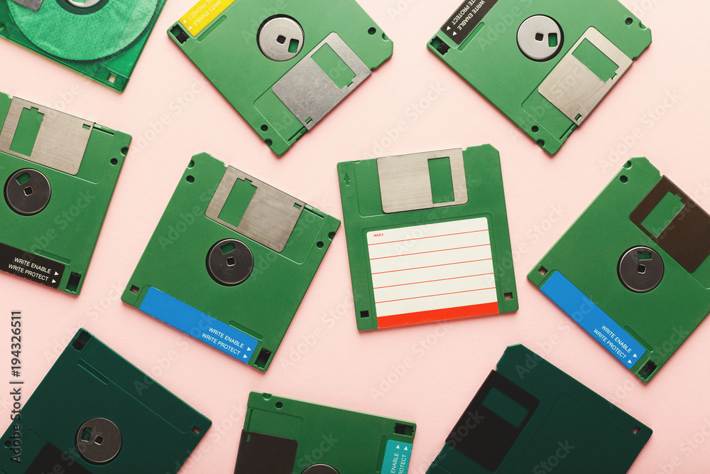 Retro floppy disks isolated on pink background Retro floppy disks isolated on pink background