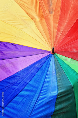 Rainbow umbrella open on the sidewalk. Sagada bus station-Mountain province-Philippines. 0242 photo