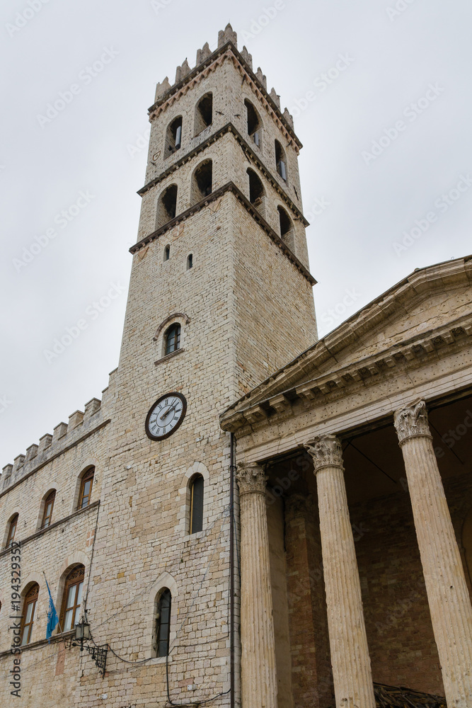 The tower with the clock on the main square of Assisi, Umbria, Italy