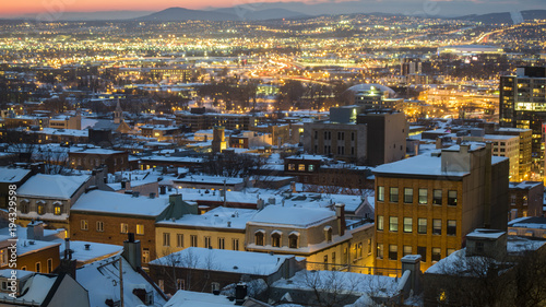 snow covered rooftops in Quebec City at sunset