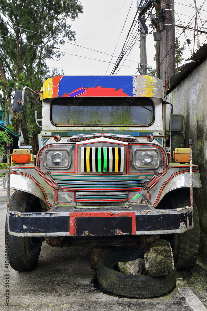 Filipino grey-silvery dyipni-jeepney car stationed in Baguio town-Benguet province-Philippines. 0249